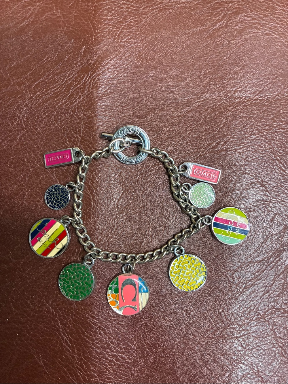 Coach toggle closure charm bracelet